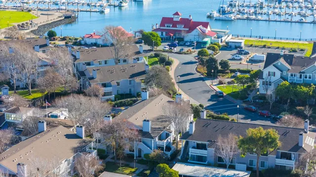 an aerial view of houses and swimming pool