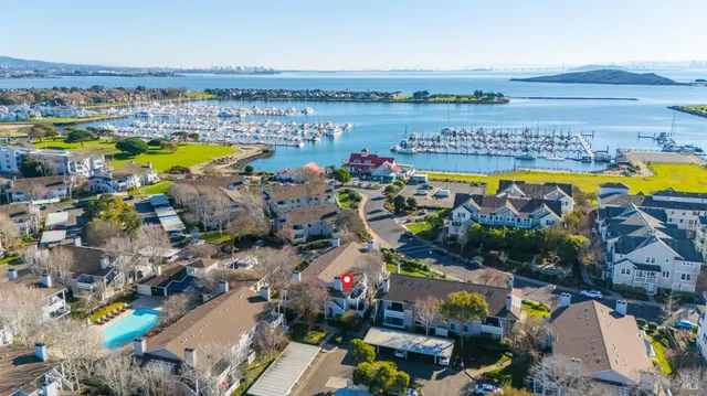 an aerial view of a swimming pool patio and outdoor seating