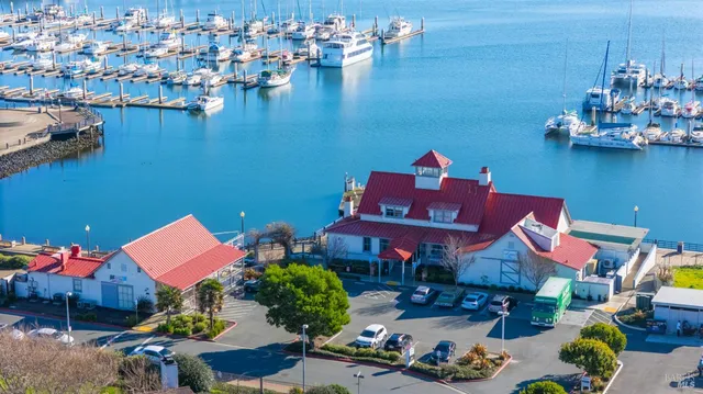 an aerial view of a house with a lake view
