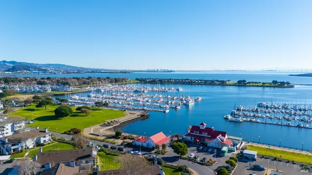 a view of a lake with a table and chairs