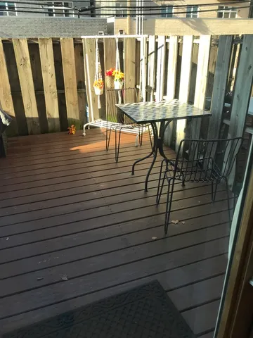 a view of a balcony with chairs