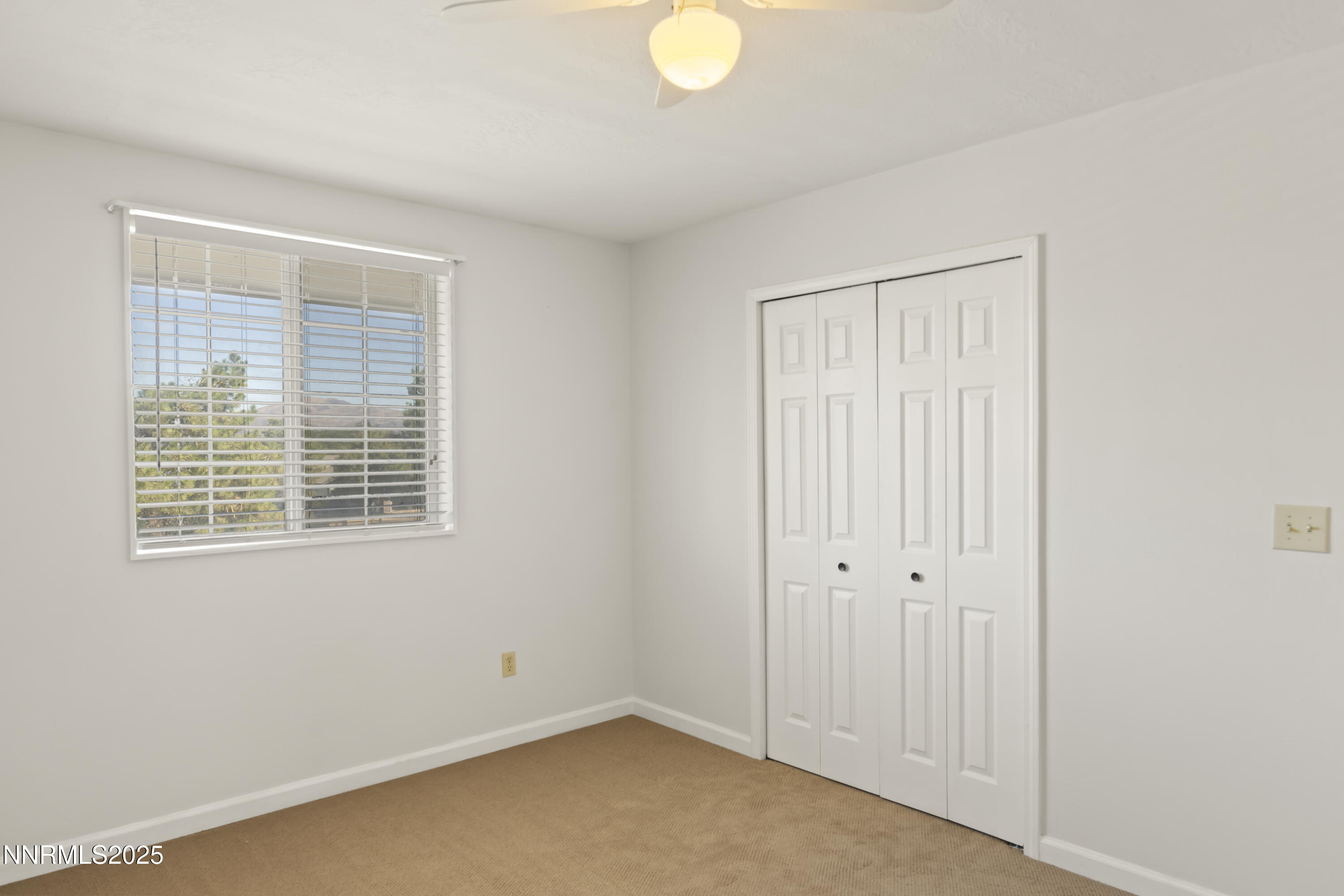 1165 Farm Lane Fernley, NV 89408 - Photo 19 of 38 a view of an empty room with a window