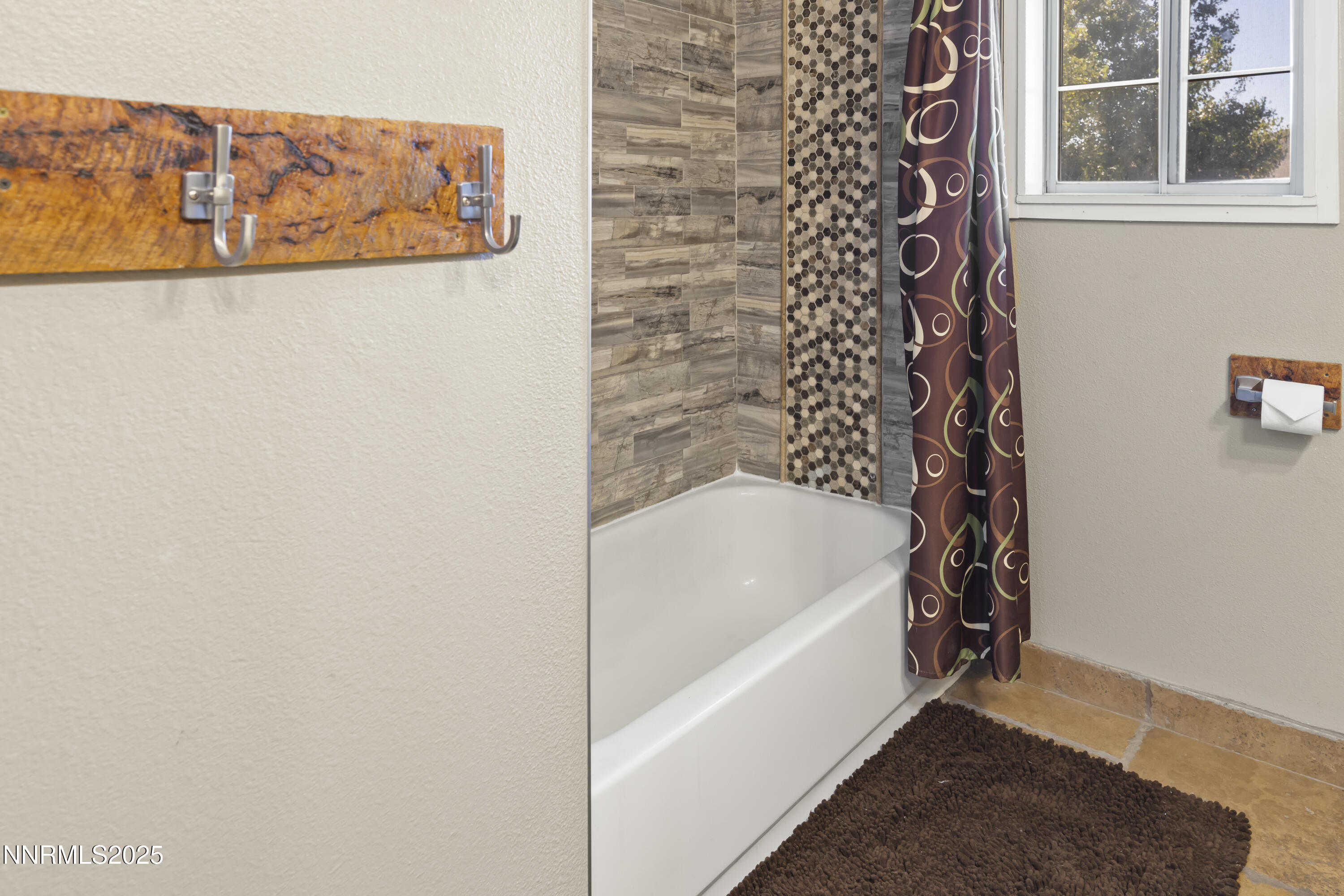 1165 Farm Lane Fernley, NV 89408 - Photo 22 of 38 a bathroom with a bathtub and shower
