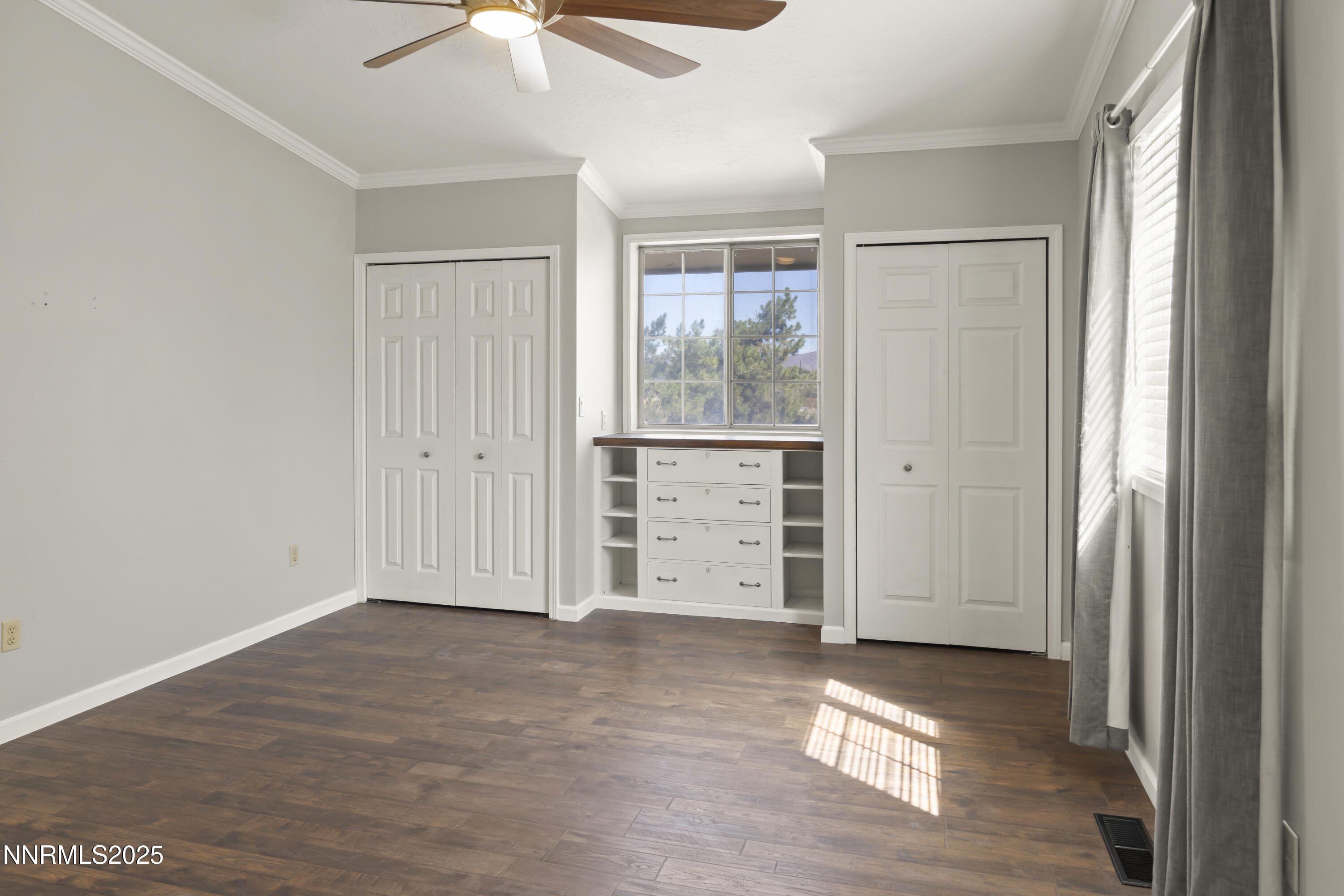 1165 Farm Lane Fernley, NV 89408 - Photo 29 of 38 an empty room with cabinet and windows