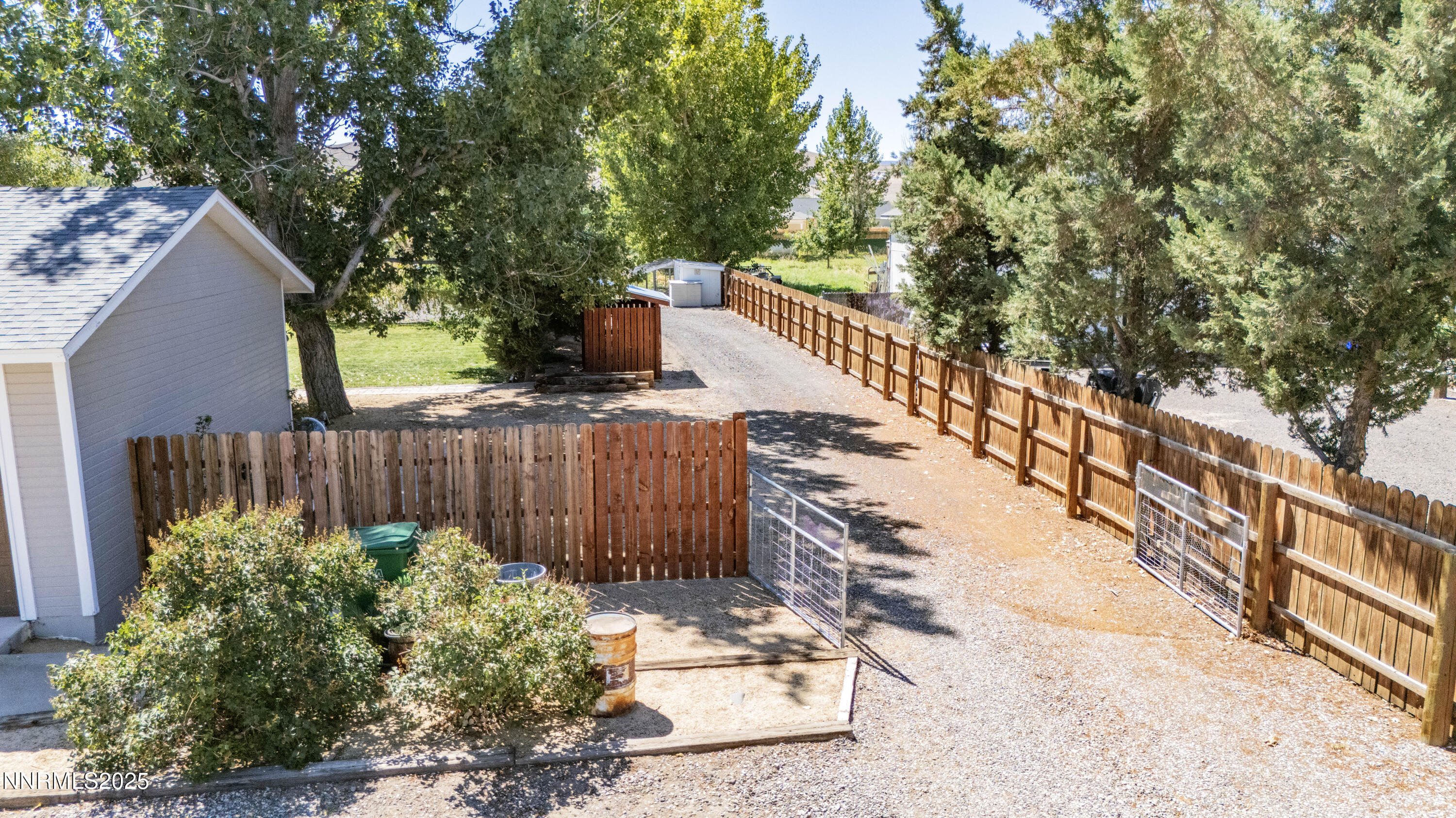 1165 Farm Lane Fernley, NV 89408 - Photo 30 of 38 a view of a yard with plants and wooden fence