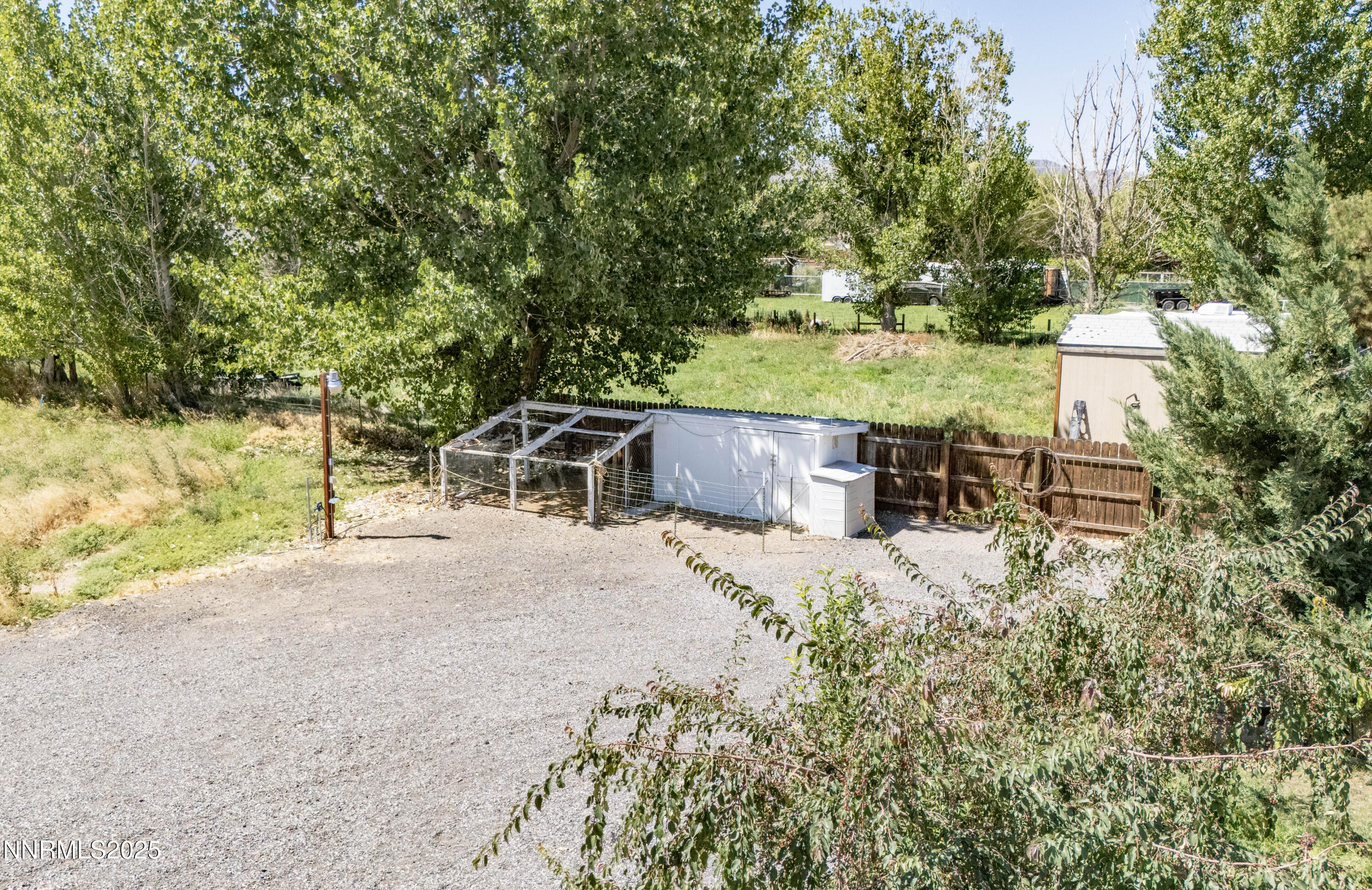 1165 Farm Lane Fernley, NV 89408 - Photo 31 of 38 a view of a chairs and table in the patio next to a yard