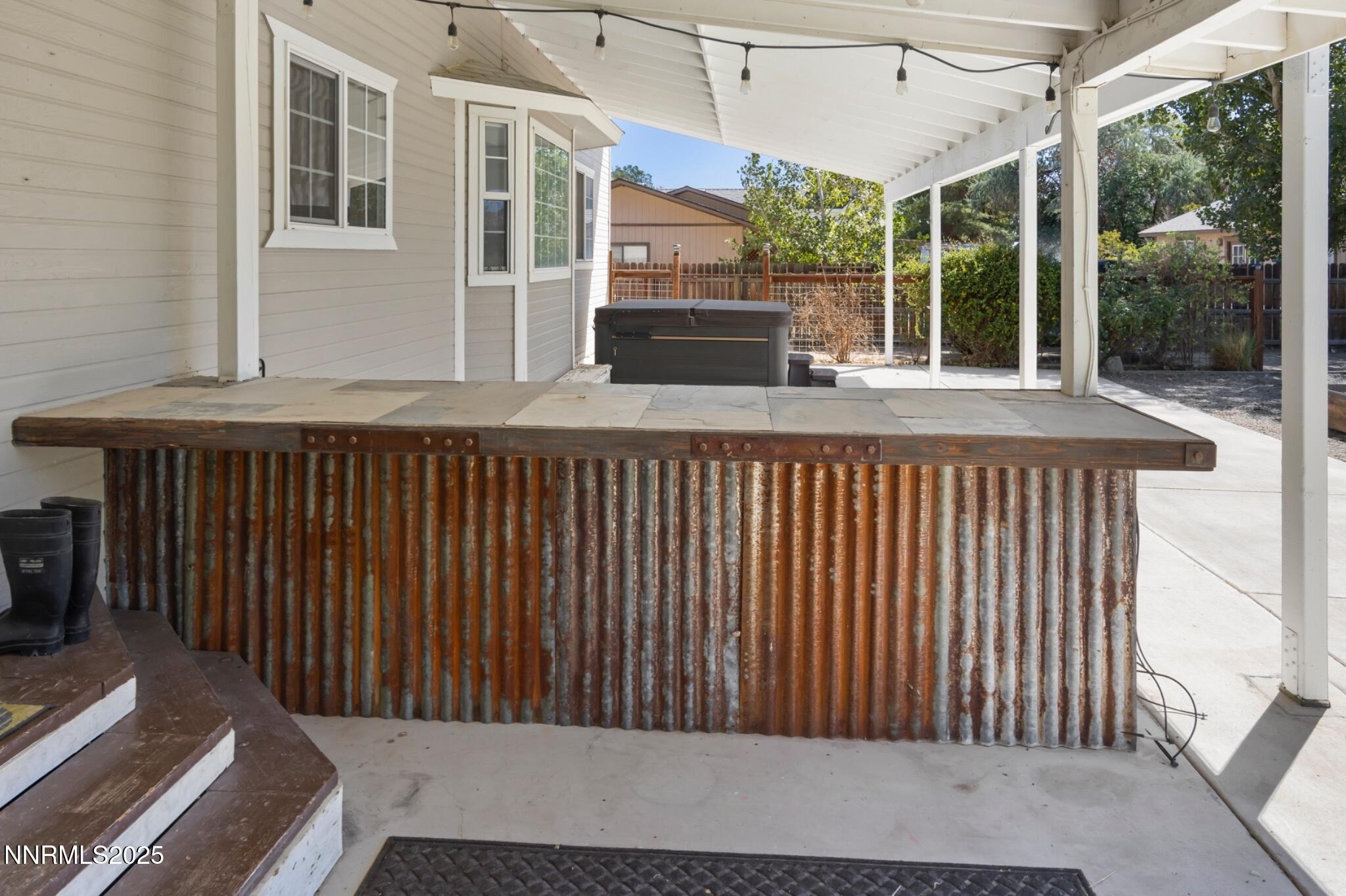 1165 Farm Lane Fernley, NV 89408 - Photo 32 of 38 a side view of a house with a balcony