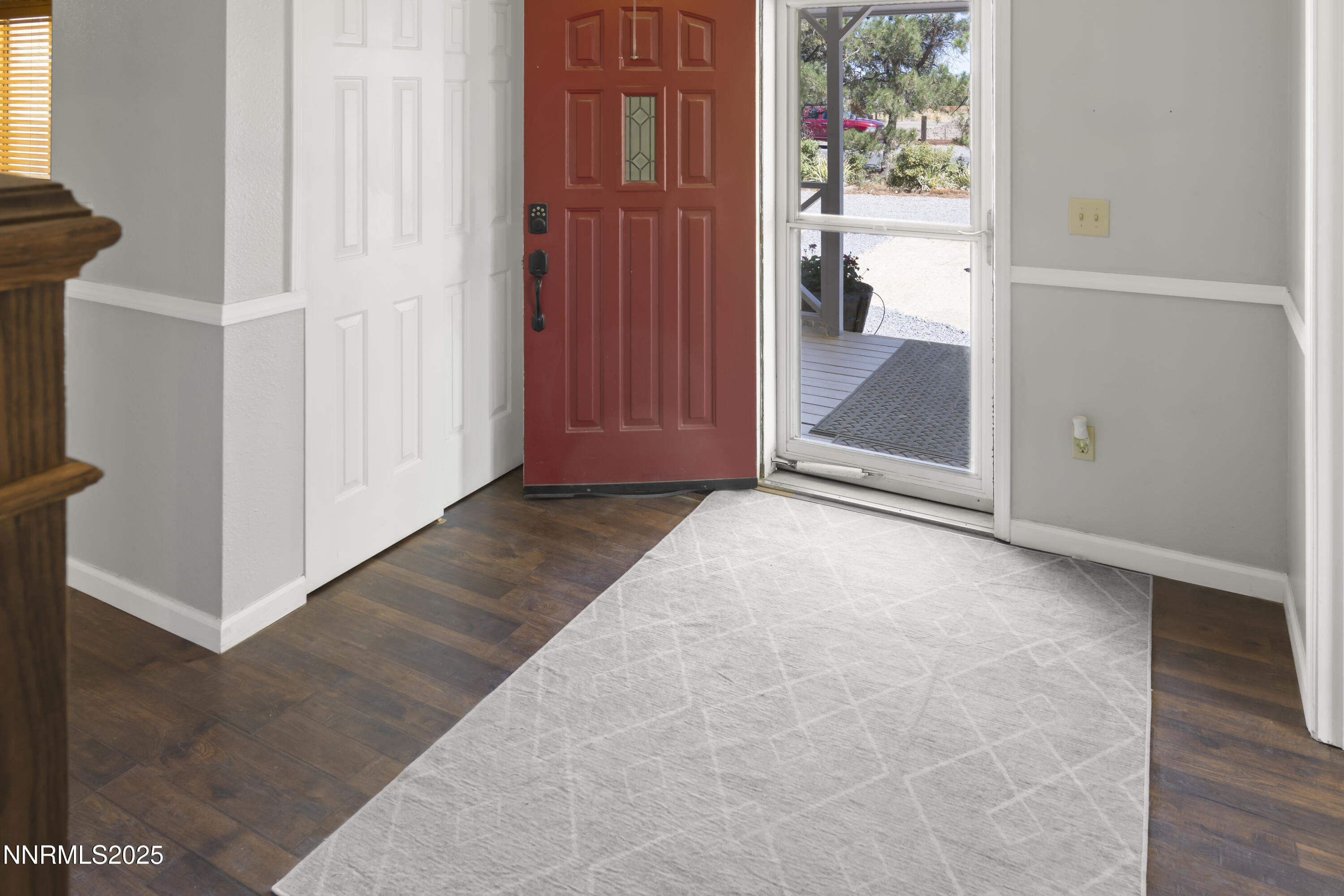 1165 Farm Lane Fernley, NV 89408 - Photo 5 of 38 an empty room with windows bathroom and entrance