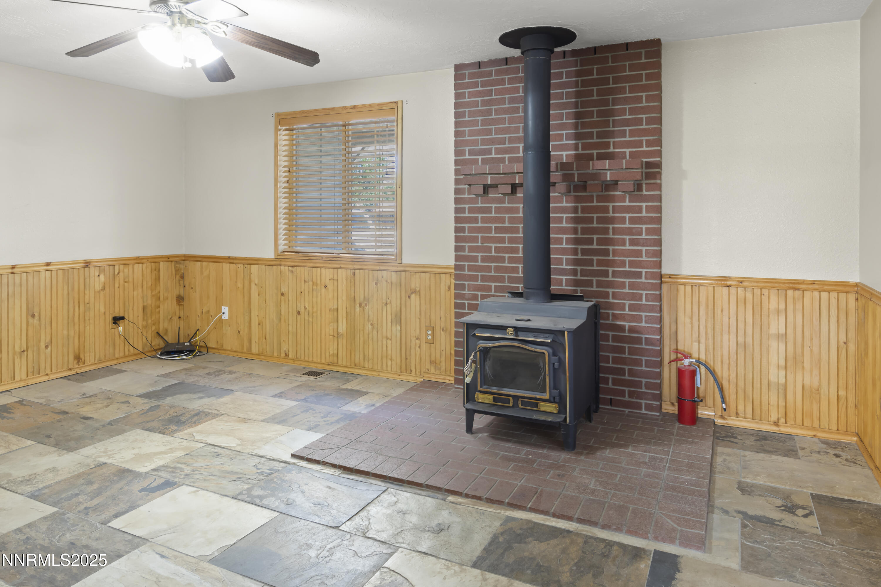 1165 Farm Lane Fernley, NV 89408 - Photo 6 of 38 a view of an empty room with a fireplace