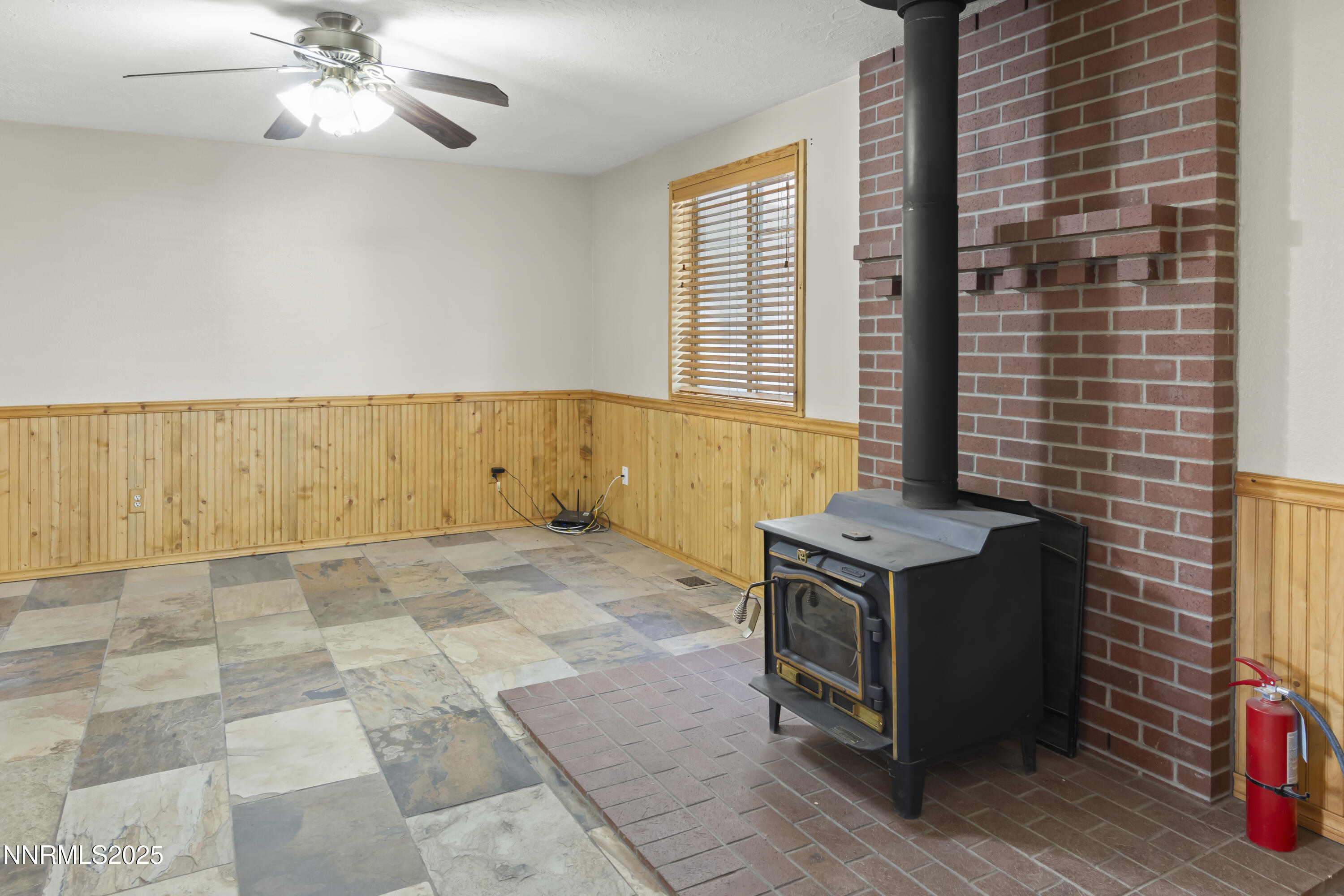 1165 Farm Lane Fernley, NV 89408 - Photo 7 of 38 a view of an empty room with a window