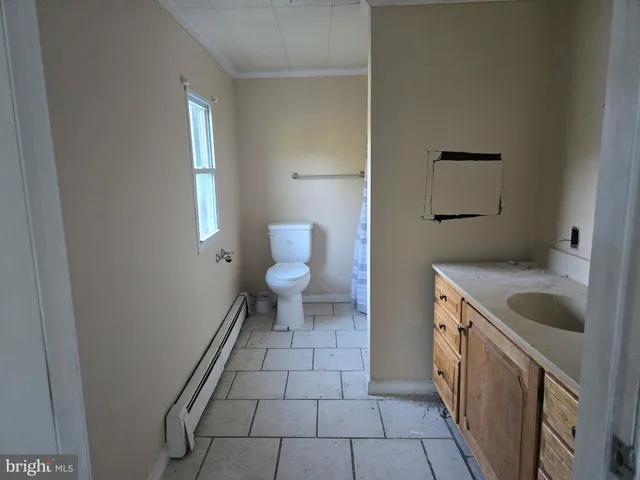 a bathroom with a sink and a toilet
