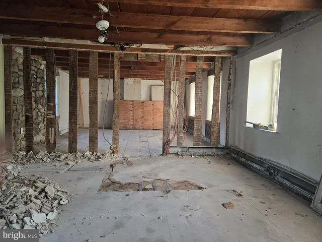 a view of a room with wooden walls