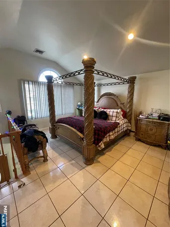 a bed room with a bed and a couch