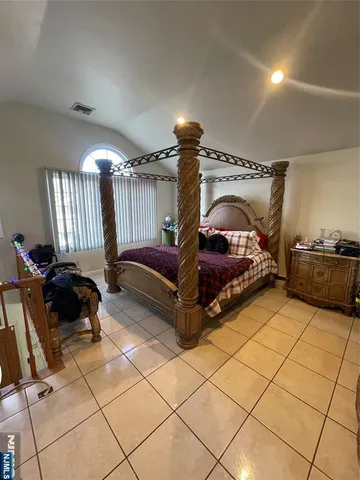 a bed room with a bed and a couch