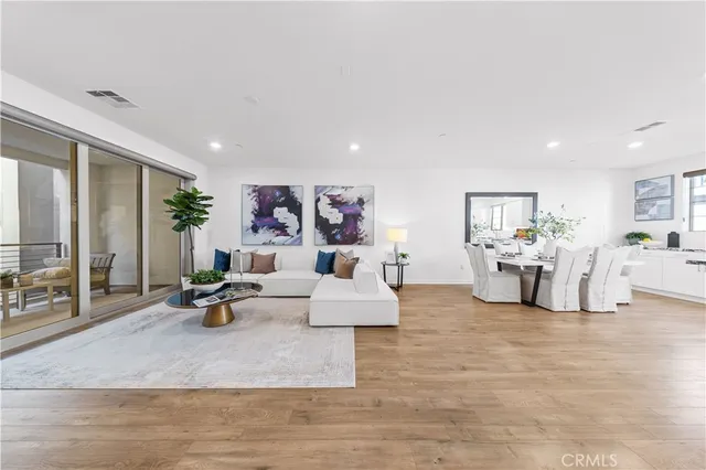 a living room with furniture and white walls