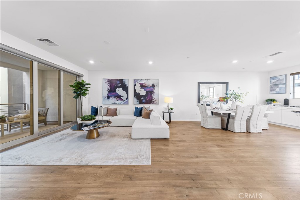 171 Cadence Irvine, CA 92618 - Photo 11 of 27 a living room with furniture and white walls