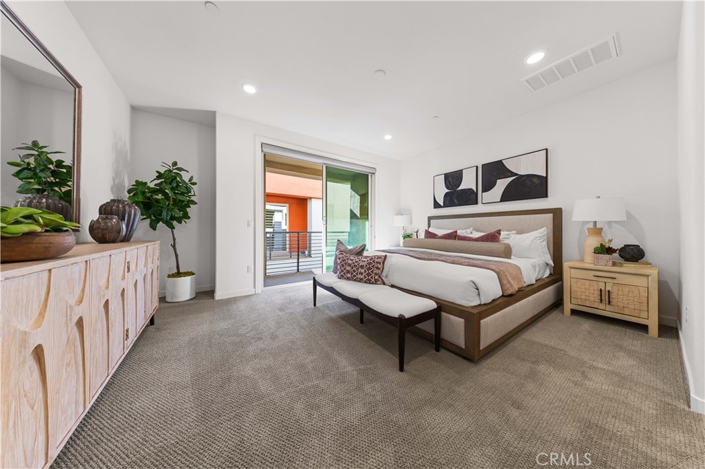 171 Cadence Irvine, CA 92618 - Photo 17 of 27 a bedroom with furniture and a bed
