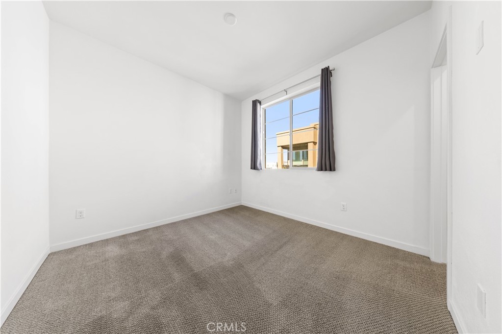 171 Cadence Irvine, CA 92618 - Photo 23 of 27 an empty room with a window