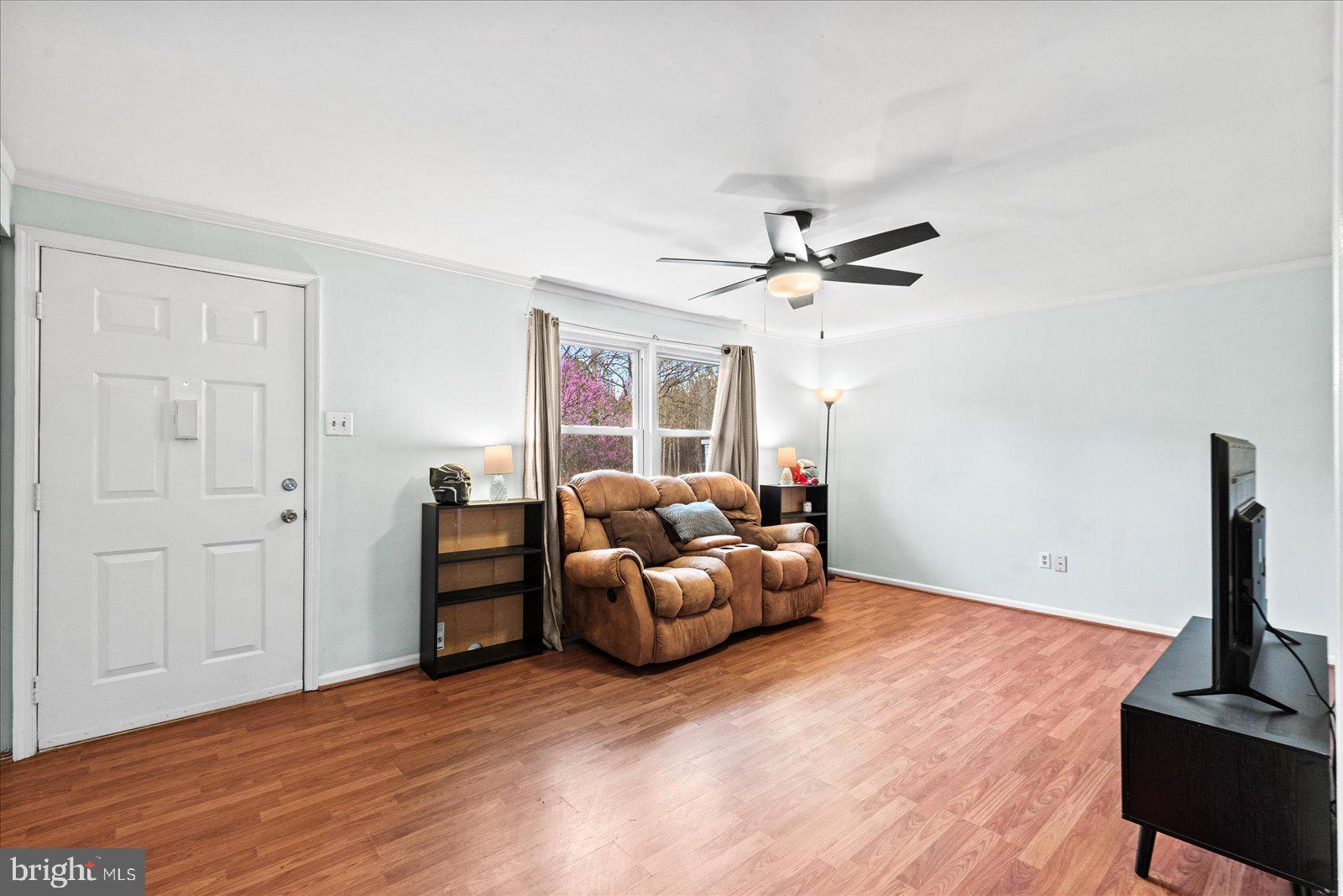 8441 Pamunkey Road Spotsylvania, VA 22551 - Photo 11 of 32 a living room with furniture and a ceiling fan