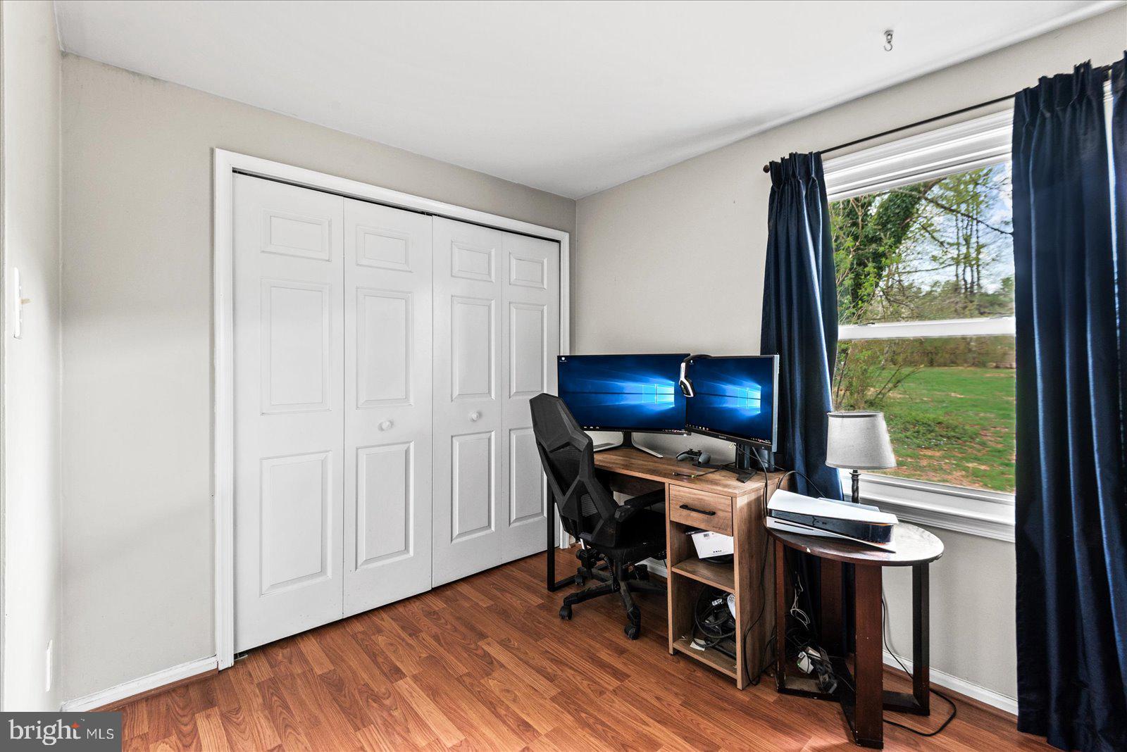 8441 Pamunkey Road Spotsylvania, VA 22551 - Photo 14 of 32 a view of a workspace with furniture and a window