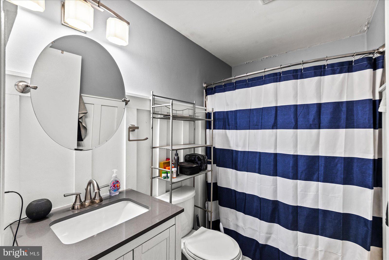 8441 Pamunkey Road Spotsylvania, VA 22551 - Photo 20 of 32 a bathroom with a sink a toilet and a mirror