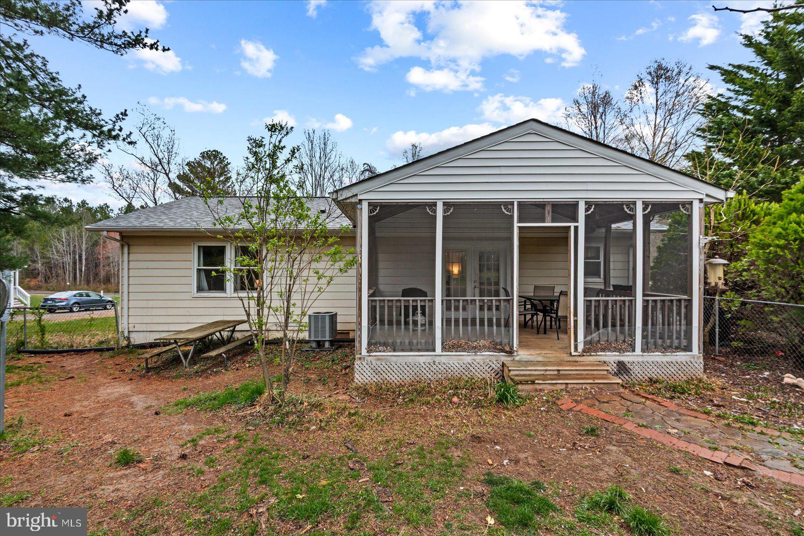 8441 Pamunkey Road Spotsylvania, VA 22551 - Photo 23 of 32 a front view of a house with garden
