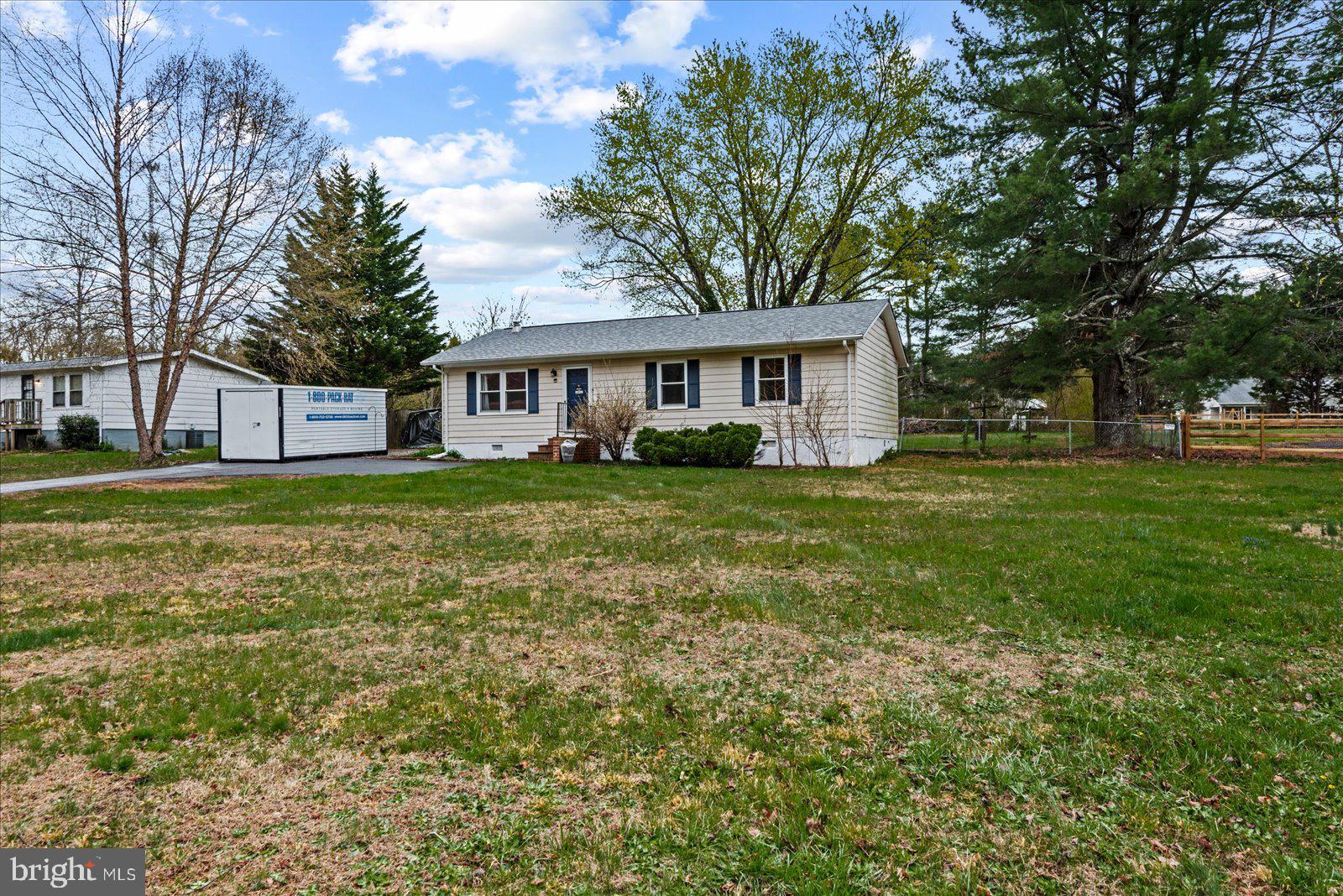 8441 Pamunkey Road Spotsylvania, VA 22551 - Photo 30 of 32 a view of a house with a big yard and large trees