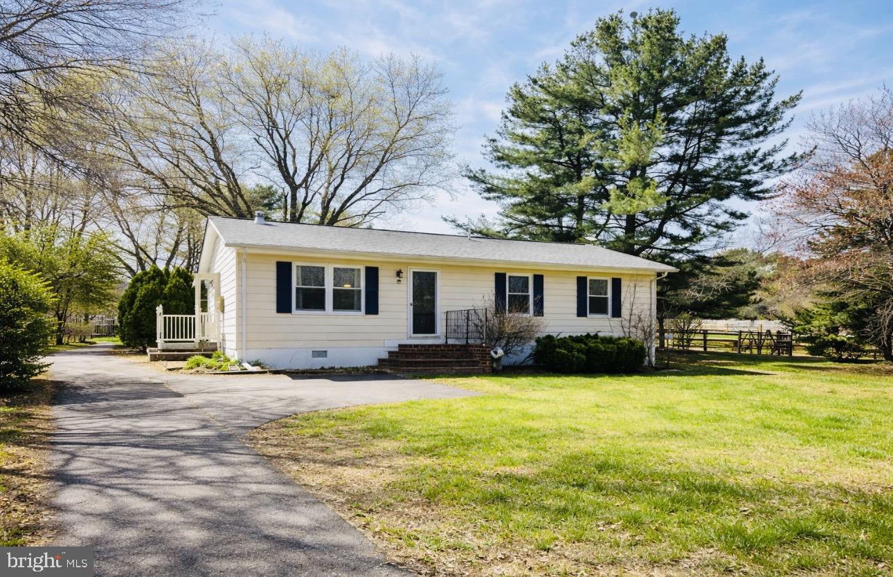 8441 Pamunkey Road Spotsylvania, VA 22551 - Photo 31 of 32 a view of a house with a big yard and large trees