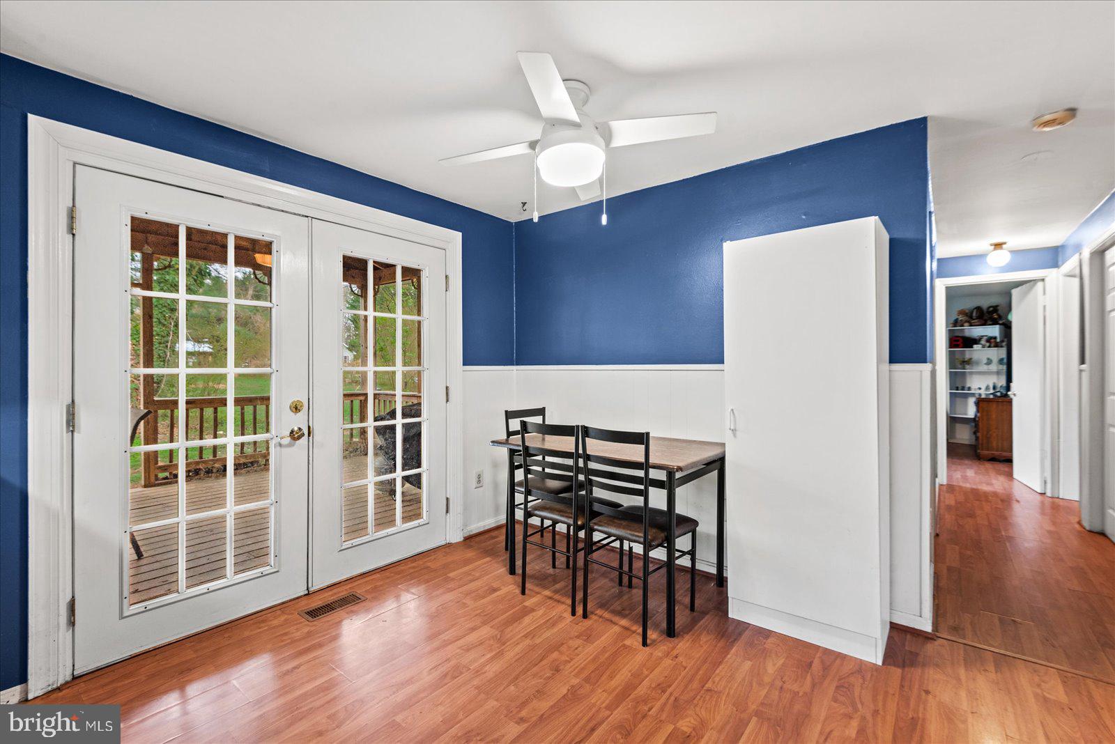 8441 Pamunkey Road Spotsylvania, VA 22551 - Photo 7 of 32 a view of dining room with furniture and wooden floor