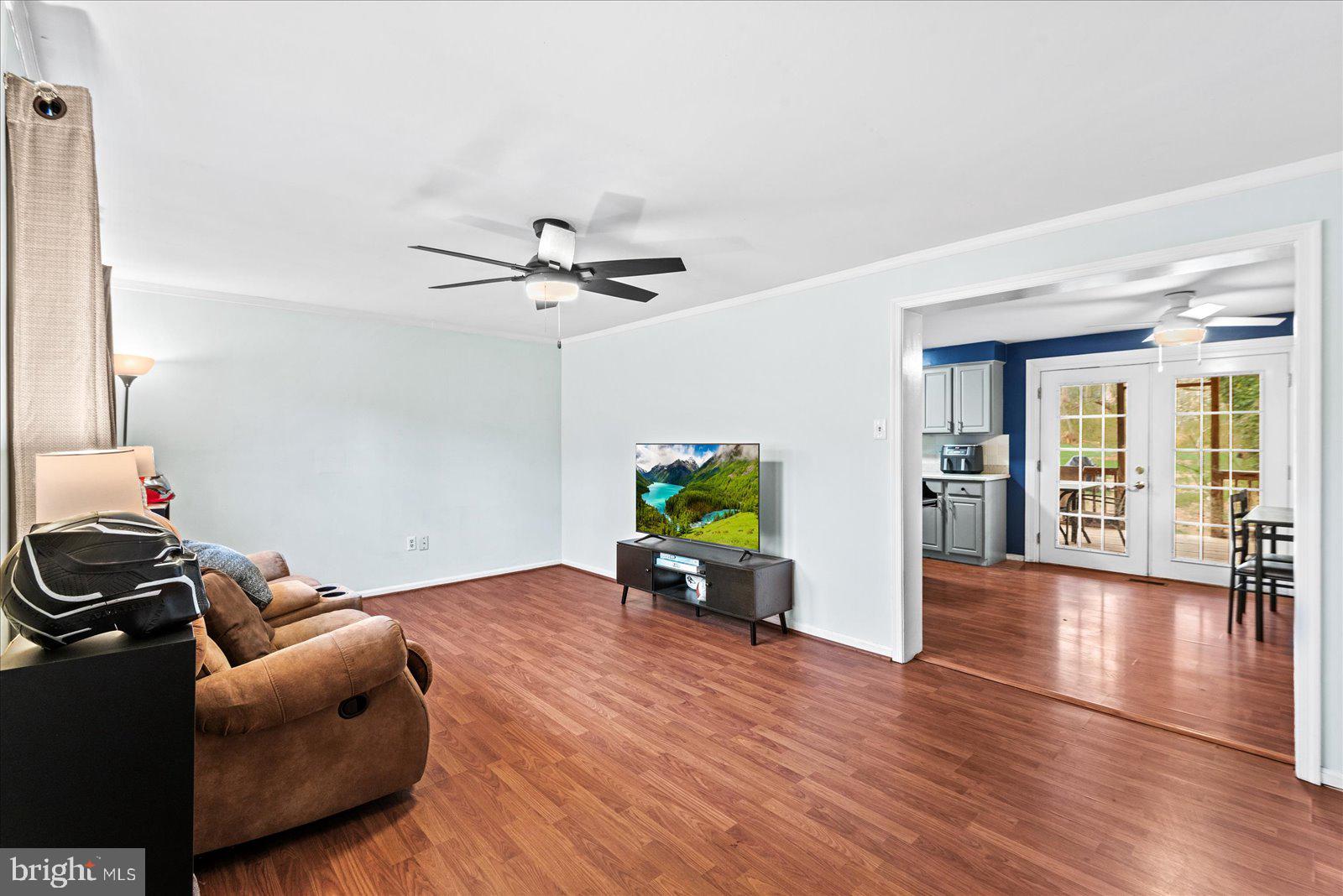 8441 Pamunkey Road Spotsylvania, VA 22551 - Photo 9 of 32 a living room with furniture and a wooden floor