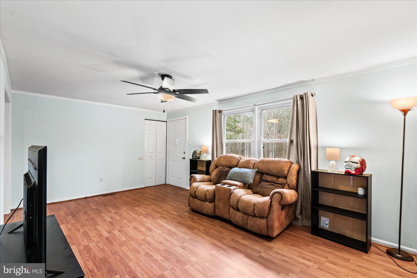 8441 Pamunkey Road Spotsylvania, VA 22551 - Photo 10 of 32 a living room with furniture and a wooden floor