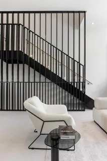 a balcony with table and chairs