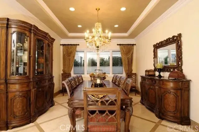 a view of a dining room with furniture large window chandelier