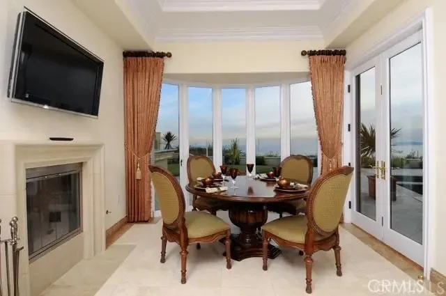 a dining room with furniture mountain view and a fireplace
