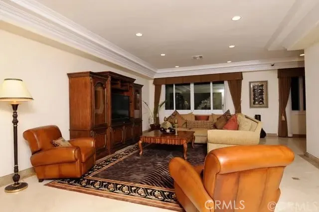 a living room with furniture rug and window