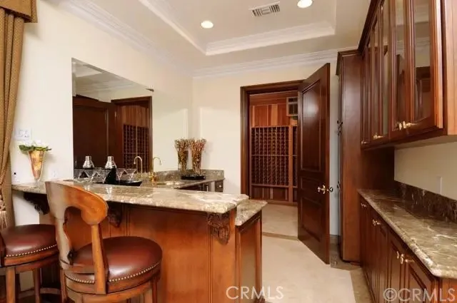 a kitchen with a stove top oven a sink and dishwasher