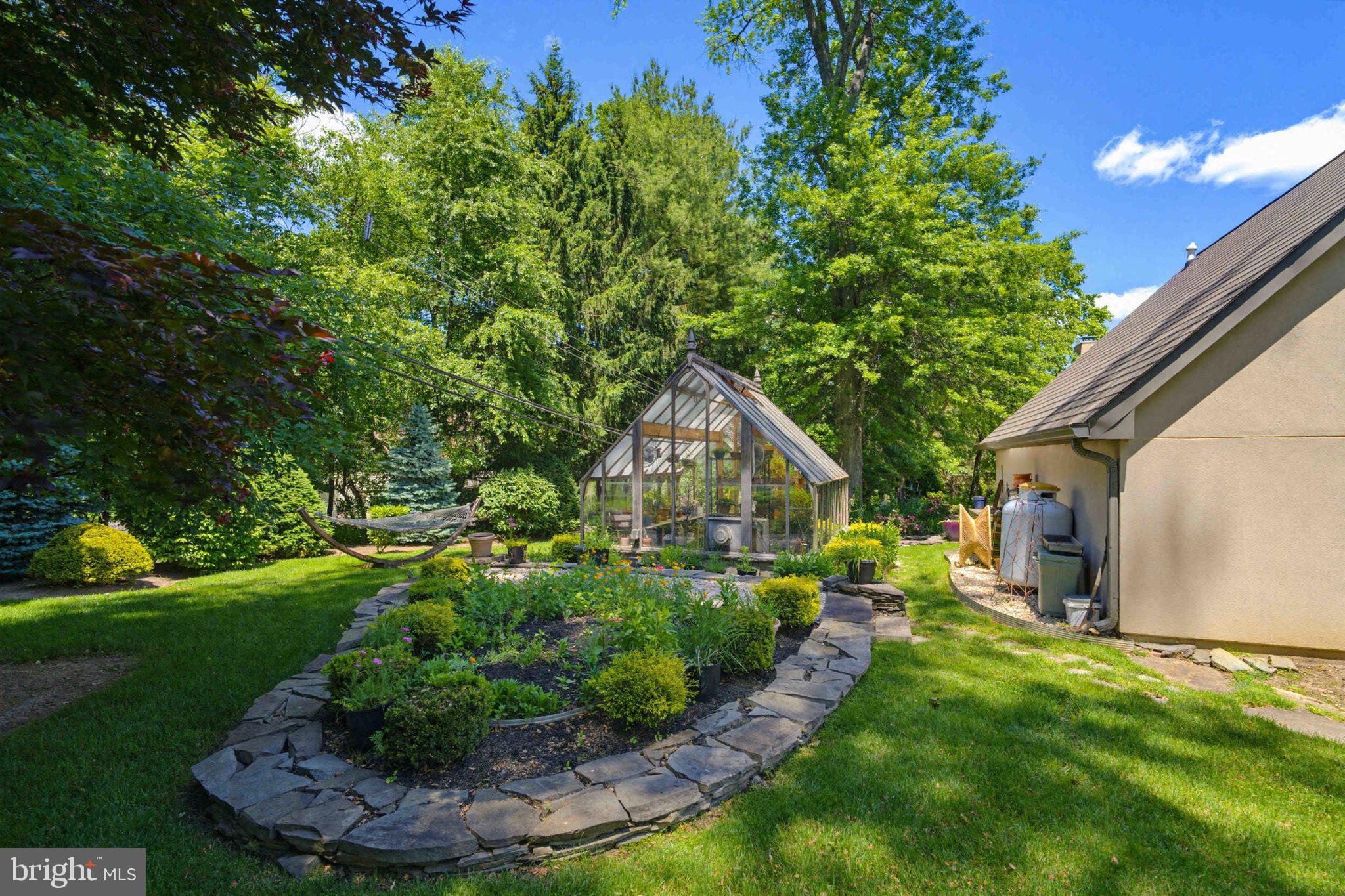 2244 Deer Path Road Huntingdon Valley, PA 19006 - Photo 83 of 95 Lush garden with charming greenhouse.