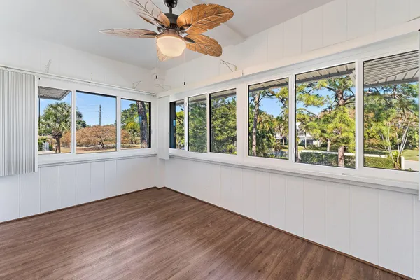 wooden floor with lots of tables and chairs