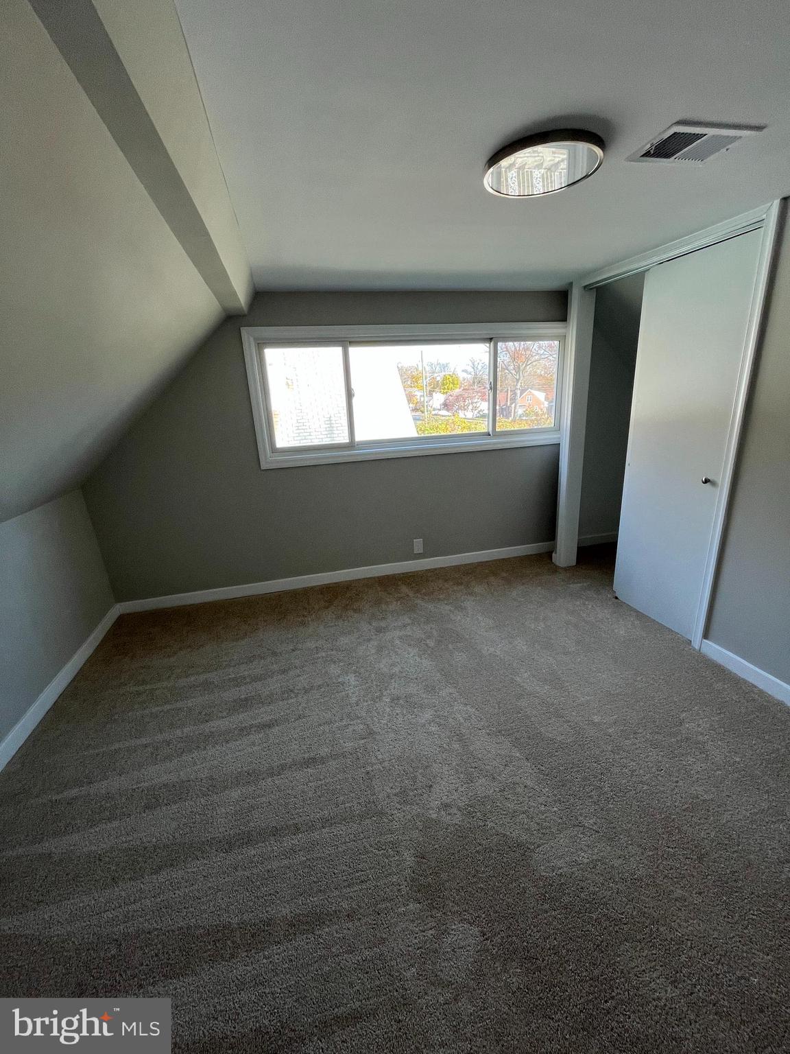 9106 Verree Road Philadelphia, PA 19115 - Photo 42 of 64 an empty room with wooden floor and windows