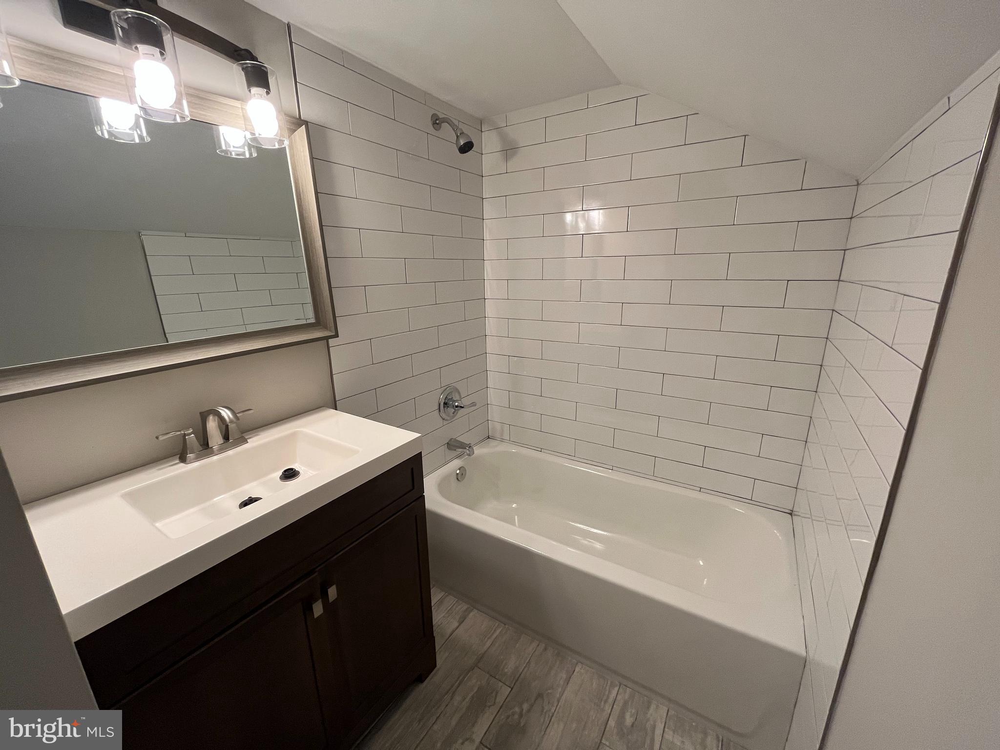 9106 Verree Road Philadelphia, PA 19115 - Photo 46 of 64 a bathroom with a bathtub and a sink