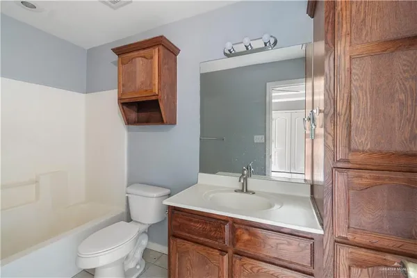 a bathroom with a sink toilet a mirror and shower