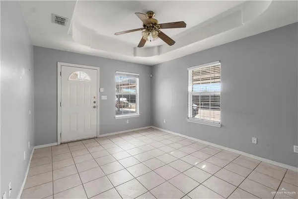 a view of an empty room with a window