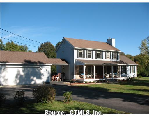 570 Waterman Road Lebanon, CT 06249 - Photo 1 of 1 a front view of a house with garden
