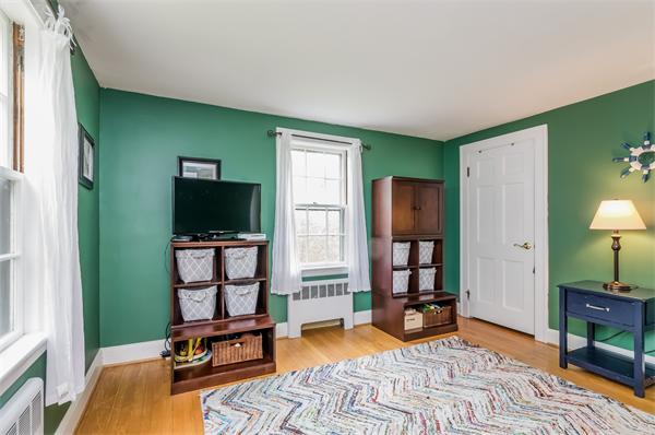 3 Revolutionary Road Lexington, MA 02421 - Photo 25 of 29 a bedroom with furniture window and a flat screen tv