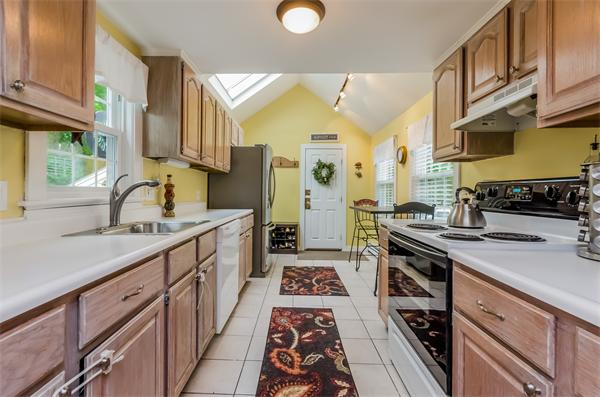3 Revolutionary Road Lexington, MA 02421 - Photo 8 of 29 a kitchen with a sink stove and cabinets