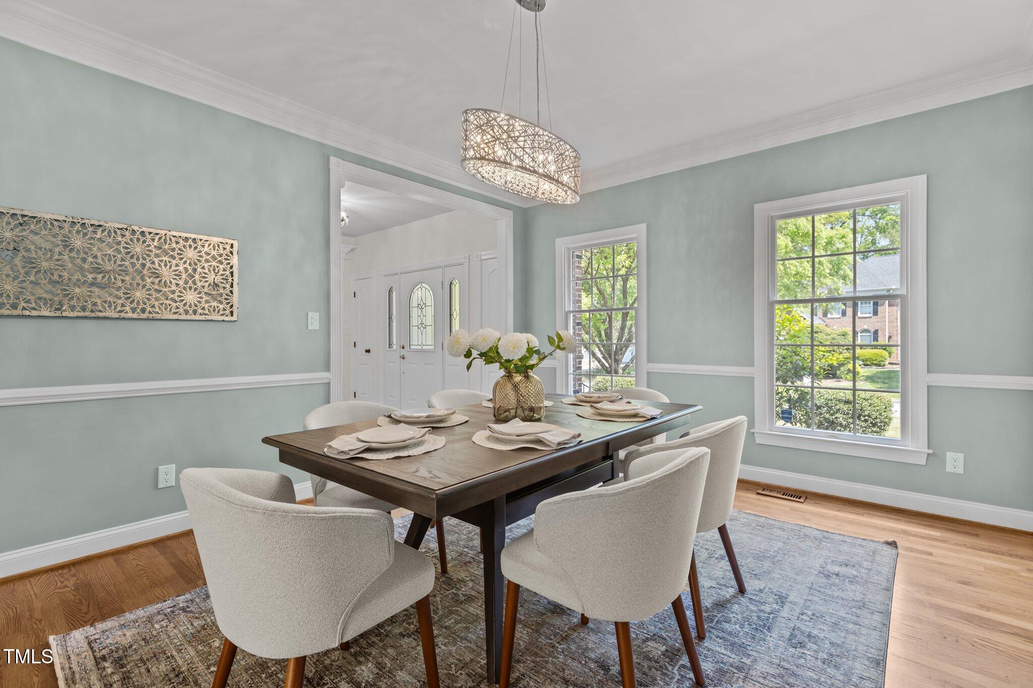 103 Ticonderoga Road Cary, NC 27519 - Photo 7 of 65 a view of a dining room with furniture window and wooden floor