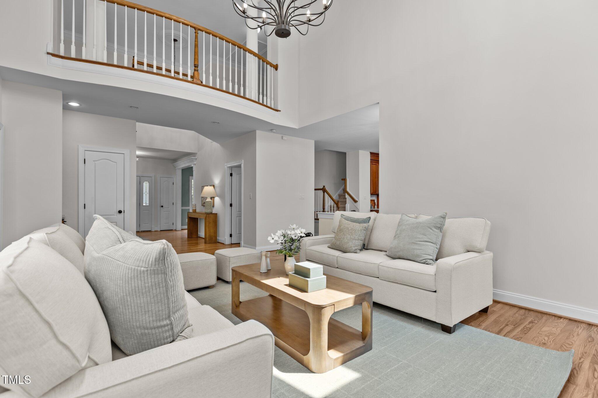 103 Ticonderoga Road Cary, NC 27519 - Photo 12 of 65 a living room with furniture a ceiling fan and a window