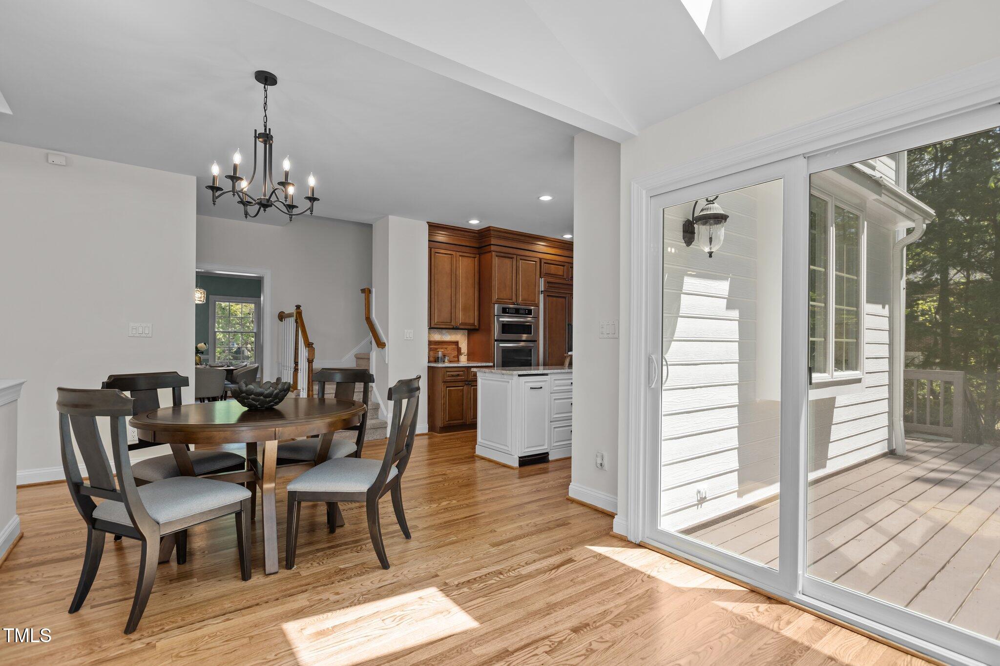103 Ticonderoga Road Cary, NC 27519 - Photo 14 of 65 a view of a dining room with furniture window and wooden floor