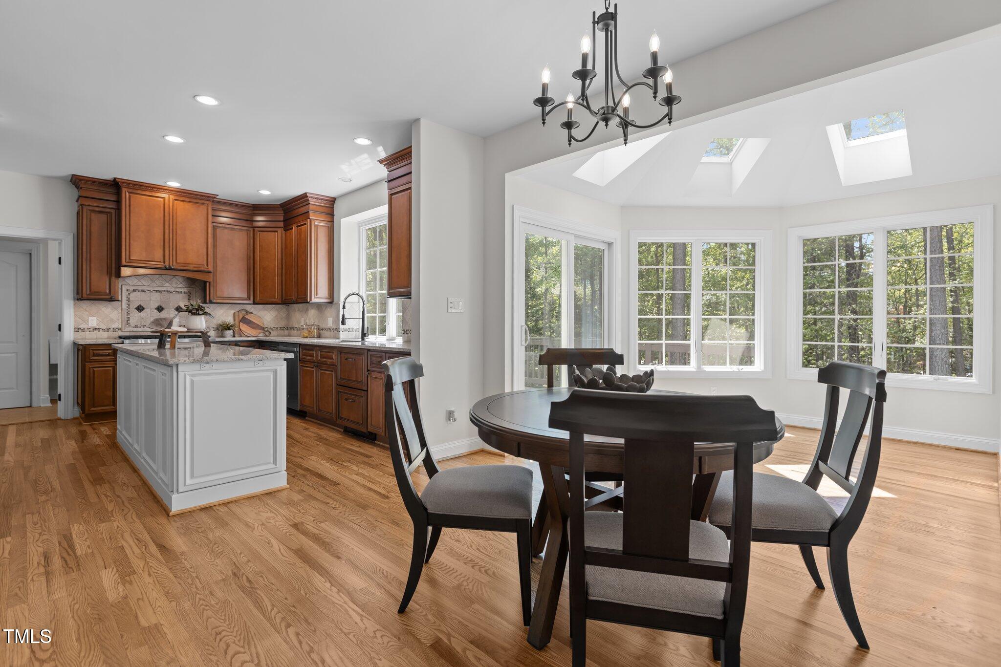 103 Ticonderoga Road Cary, NC 27519 - Photo 15 of 65 a view of a dining room with furniture window and outside view