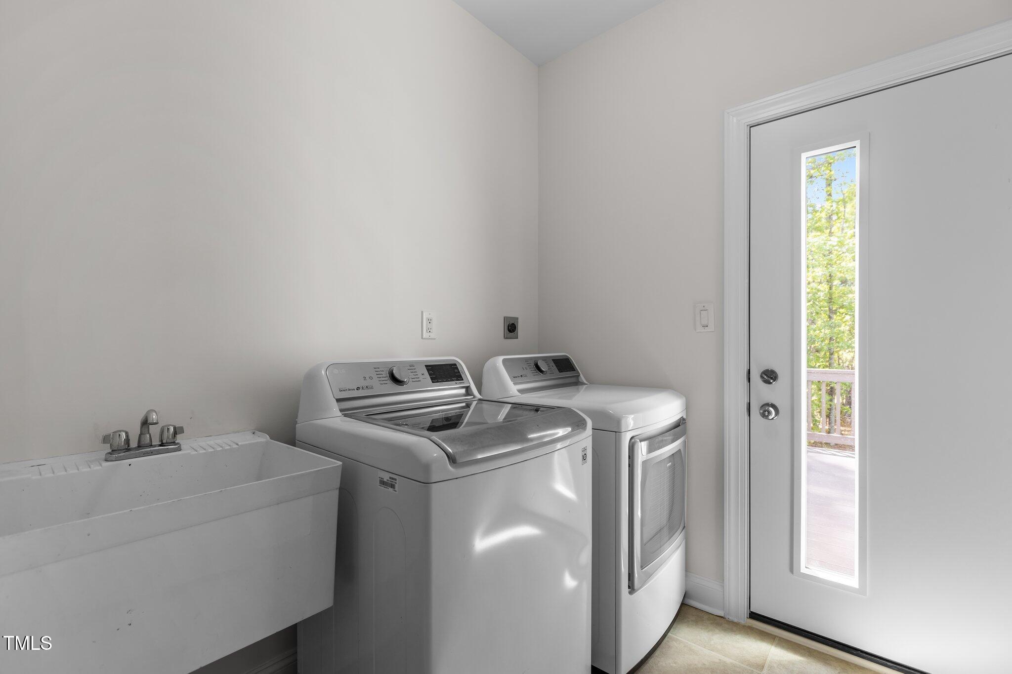 103 Ticonderoga Road Cary, NC 27519 - Photo 21 of 65 a utility room with dryer and washer